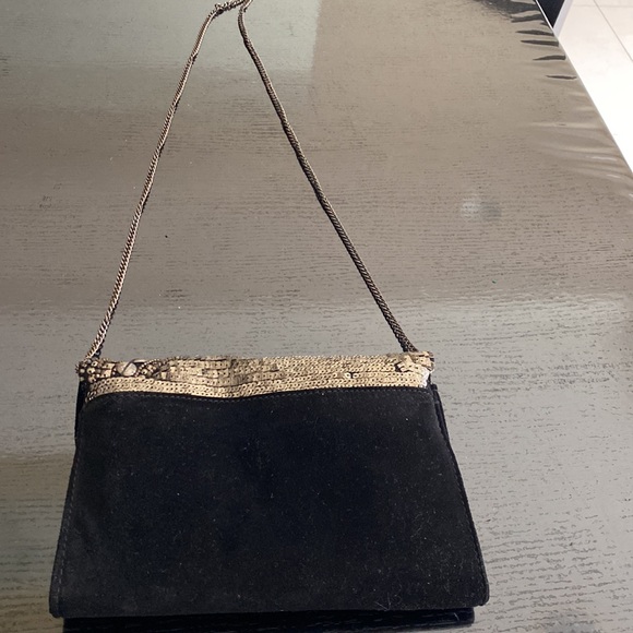 New handcrafted & embroidered black velvet handbag with studs & sequins.